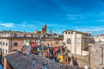 Fototapeta na wymiar Blue sky over old roofs in Rome