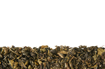 A pile of dry green tea. Isolated on white background. Food background.