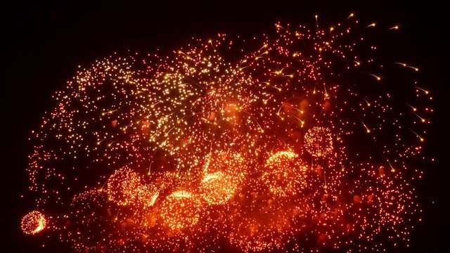 Firework display at night on black background. Bright red green yellow explosions. Amazingly beautiful. Salute for new year Christmas and other holidays. Macro video closeup footage 4k.