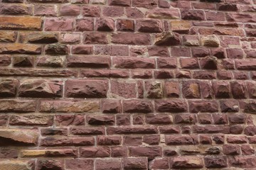 Historic red stone wall texture background