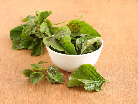 Amaranth leaves, fresh and organic type, in a bowl.