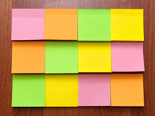 Color blank sticky notes on wood board