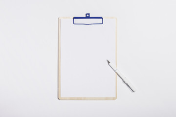 clipboard with smart phone, fountain pen on the white background.