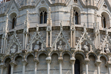 Details of the exterior of the Pisa Baptistery of St. John, the largest baptistery in Italy, in the Square of Miracles, Pisa, Italy.