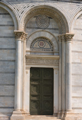 Details of the exterior of the Pisa Baptistery of St. John, the largest baptistery in Italy, in the Square of Miracles (Piazza dei Miracoli), Pisa, Italy.