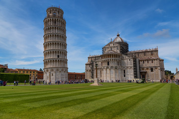 Stunning daily view at the Pisa Baptistery, the Pisa Cathedral and the Tower of Pisa. They are located in the Piazza dei Miracoli (Square of Miracles) in Pisa, Italy. 