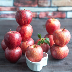 Fototapeta na wymiar red, juicy apples on the table