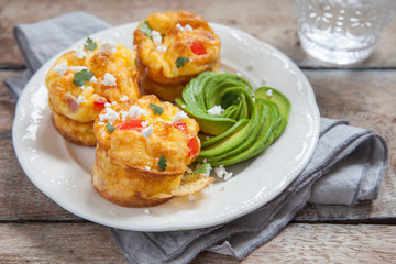 Obraz na płótnie Canvas Delicious egg muffins with ham, cheese and vegetables