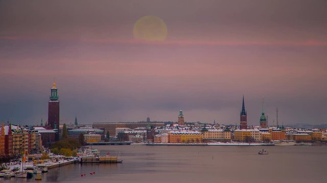 Time lapse of Stockholm in winter time at dusk. Animated moonrise. 