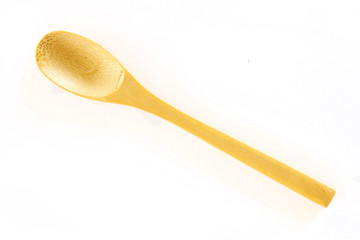 Wooden spoon on white background