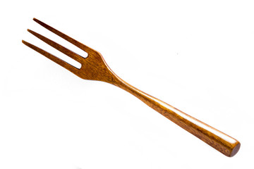 Wooden fork on white background