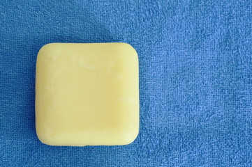 yellow soap and blue towel