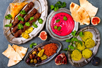 Middle Eastern traditional dinner. Authentic arab cuisine. Meze party food. Top view, flat lay, overhead