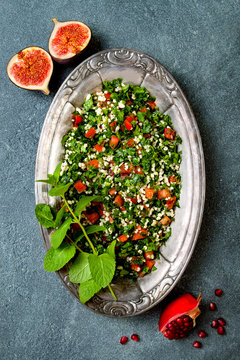 Middle Eastern traditional salad Tabbouleh. Authentic arab cuisine. Top view, flat lay, overhead