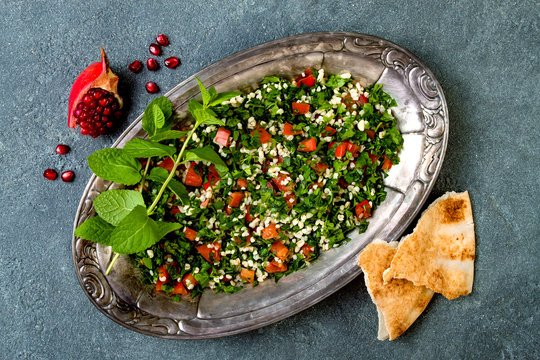 Middle Eastern traditional salad Tabbouleh. Authentic arab cuisine. Top view, flat lay, overhead