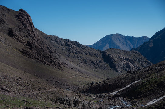 Toubkal national park in springtime. Valley near Refuge Toubkal, start point for hike to Jebel Toubkal, – highest peak of Atlas mountains and Morocco
