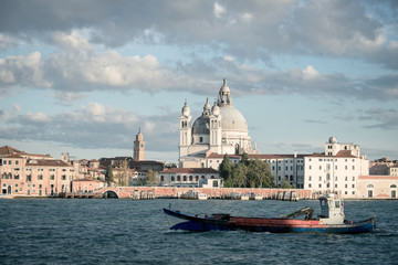 Basilica di Santa Maria della Salute, Background Venice in Italy with boats and church Salute, Basilica Salute with ship in Venice