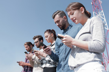 young people using smartphones to search network