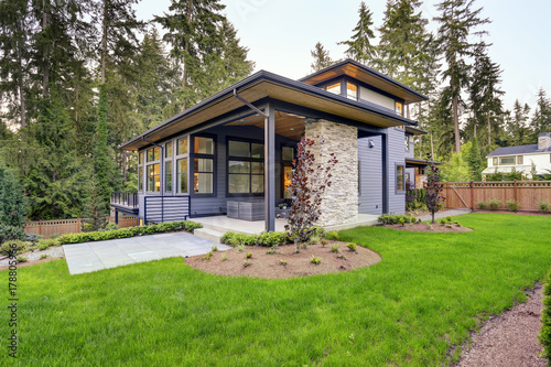 "New modern home features a backyard with patio" Stockfotos und