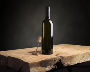 Rolgordijnen red wine bottle and wine glass on wodden barrel © kishivan
