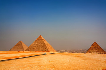 Fototapeta na wymiar The Great Pyramids towering beyond Giza city