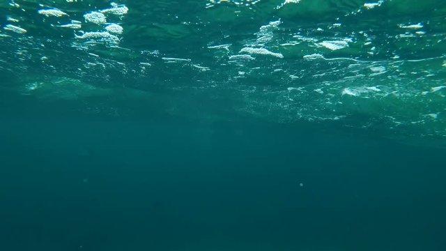 Storm wave in shallow water (underwater split level) 
