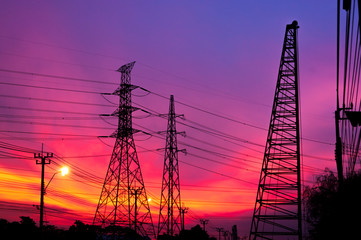 High voltage post.High-voltage tower sky with sun