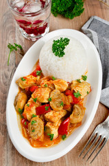 Chicken stew with mushrooms served  with rice