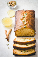 Honey cinnamon pumpkin seeds nuts loaf cake, sliced. Top view.