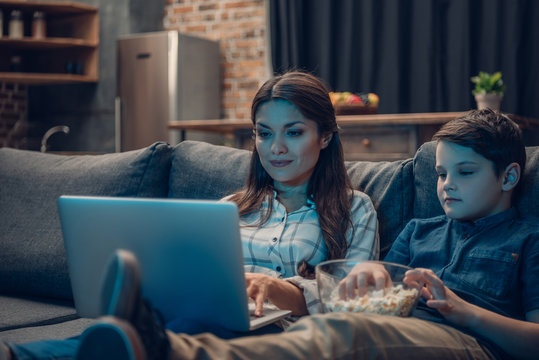 Family Watching Movie On Laptop