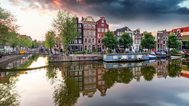 Amsterdam Canal houses at sunset reflections time lapse, Netherlands