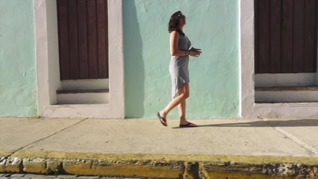 Slow motion of female tourist walking around Puerto Rico - Cuba