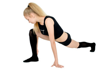 Fitness woman doing stretching workout. Full length shot of young woman on white background. Stretching and motivation
