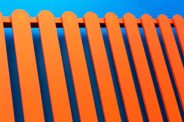 Orange fence and blue wall texture background