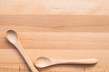 Wooden spoon on wooden background