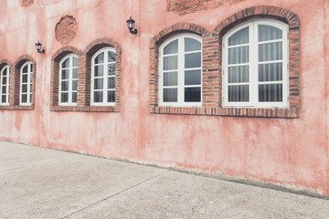 window on red wall in vintage style. Italy home style
