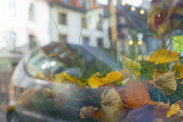 Reflection of the city in the glass in the fall