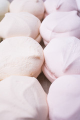 Fototapeta na wymiar Multicolored sweet marshmallows close-up, vertical frame