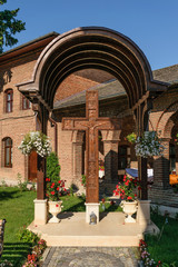 Jesus Christ carved on big wooden cross at Plumbuita monastery in Bucharest, Romania.