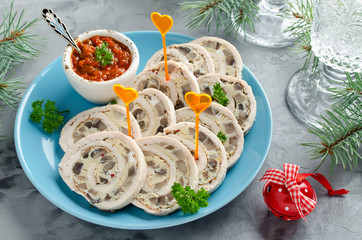 Chicken roll (roulade) with omelet (omelette) and mushrooms