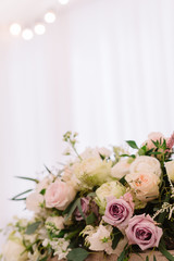 Floral bouquet with the white and lilac roses and greenery