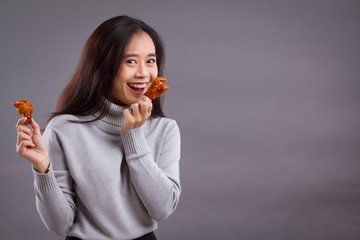 happy woman with fried chicken