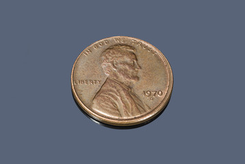 US coin of one cent on a dark background