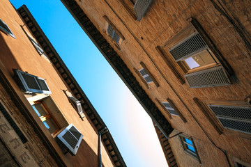 Urbino, Italy - August 9, 2017: architectural elements of a building in the old town of Urbino.