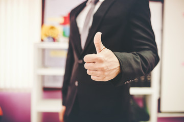  thumbs up. Close-up of a young businessman showing