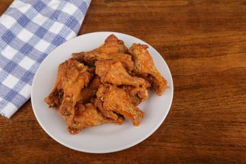Buffalo Wings on White Plate and Wood Table