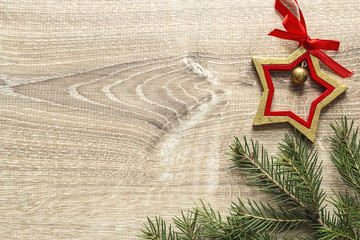 Fir branches and Christmas decorations on wooden background. Space for text.