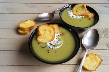 vegetarian cream soup of green vegetables. on a black background