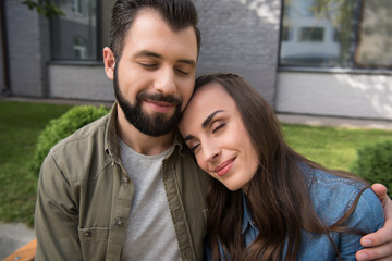 Fototapeta premium couple hugging with closed eyes