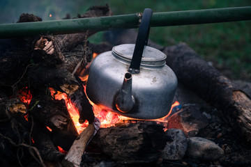 boiling a water for make coffee in a campfire